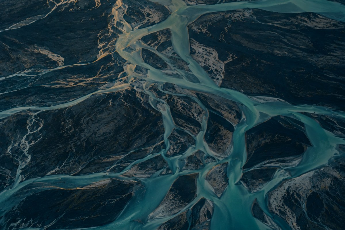 Aerial view of a braided river delta splitting into many channels